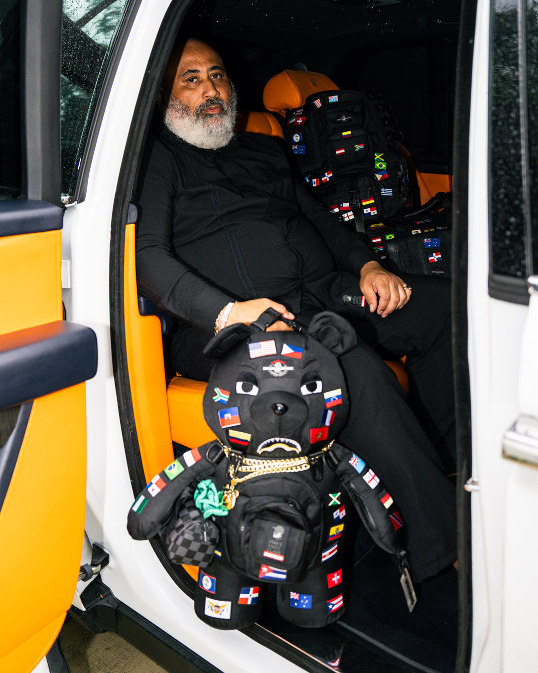 JAMES FIRST CLASS GLOBAL FLAGS MONEYBEAR BACKPACK